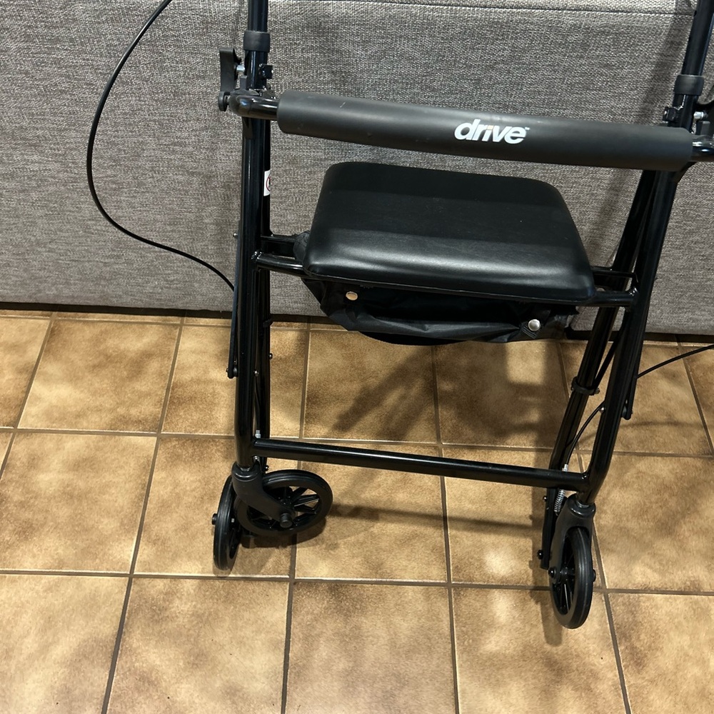 4  wheel walker with hand brakes, Black and seat with storage